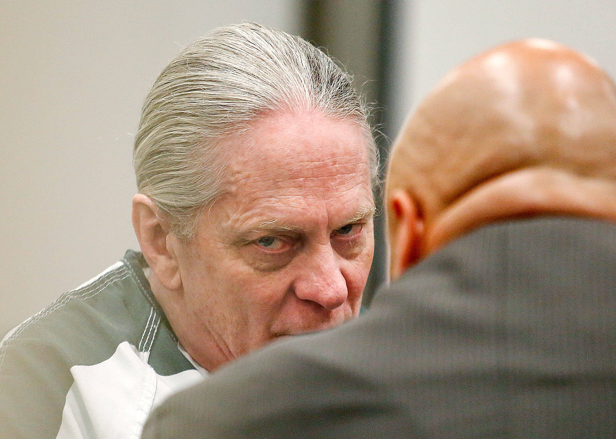 Convicted bank robber Christian Franzwa listens to his attorney Jon Scott moments before his sentencing hearing begins with Judge Eric Lucas in Snohomish County Superior Court, Wednesday. (Dan Bates / The Herald)