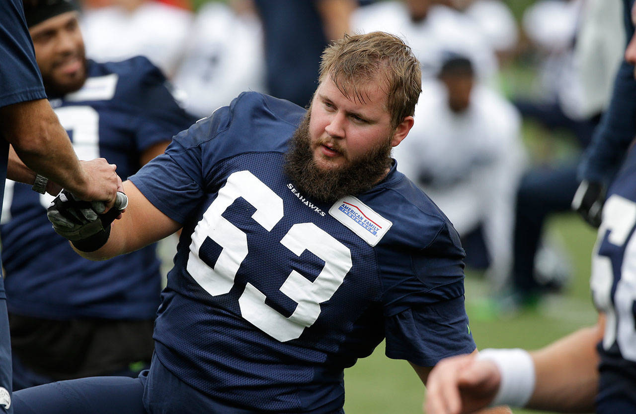 Seahawks offensive lineman Mark Glowinski stretches during training camp on July 30, 2016, in Renton. (AP Photo/Elaine Thompson)