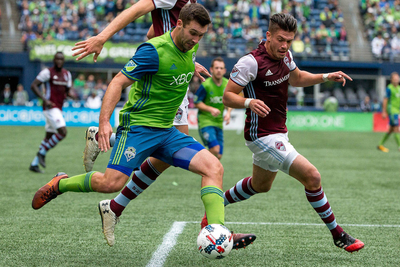 Sounders defender Will Bruin (17) gets the ball past Rapids defender Mike da Fonte (2) during the first half of an MLS match on Oct. 22, 2017, in Seattle. (Courtney Pedroza/The Seattle Times via AP)