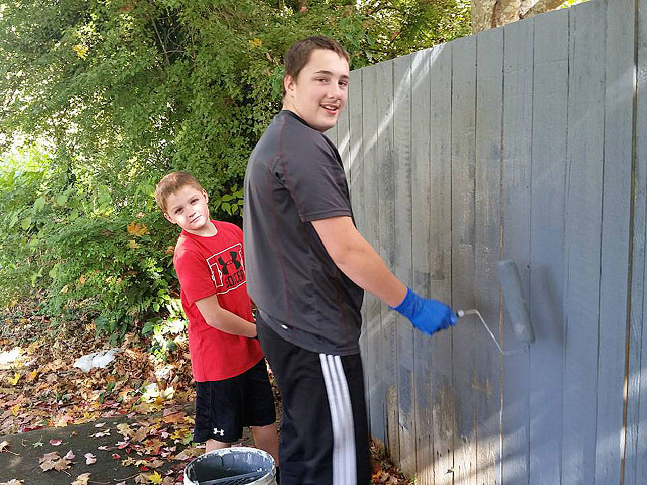 Anthany-Jay Van Volkenburg, 10 and his stepbrother Alex Nelson, 15, grabbed rollers and joined in with the Arlington Graffiti Brigade to paint over tagging along a fence on 31st Avenue Oct. 8. The boys were just riding by on their bikes, and when they learned what the group was doing, they stopped and volunteered. Said Brigade leader Vikki McMurray, “I was just absolutely thrilled that young people want to be involved.” (Marysville Globe)