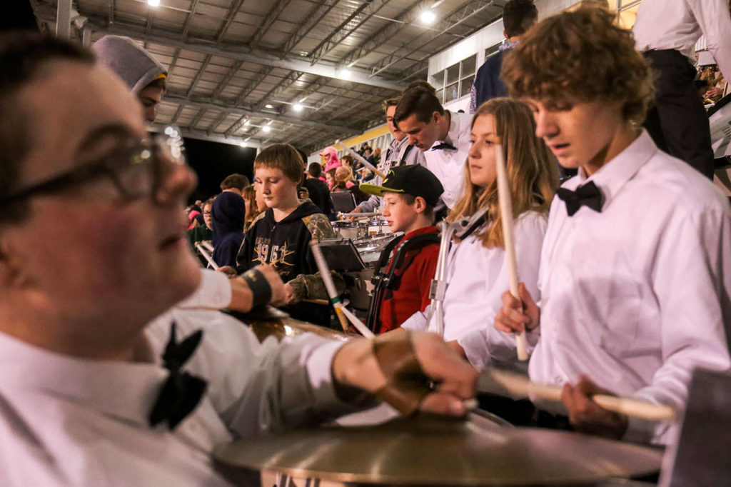 Members of Darrington’s newly formed band plays among Arlington’s band Friday night at Arlington High in Arlington on October 20, 2017. (Kevin Clark / The Herald)
