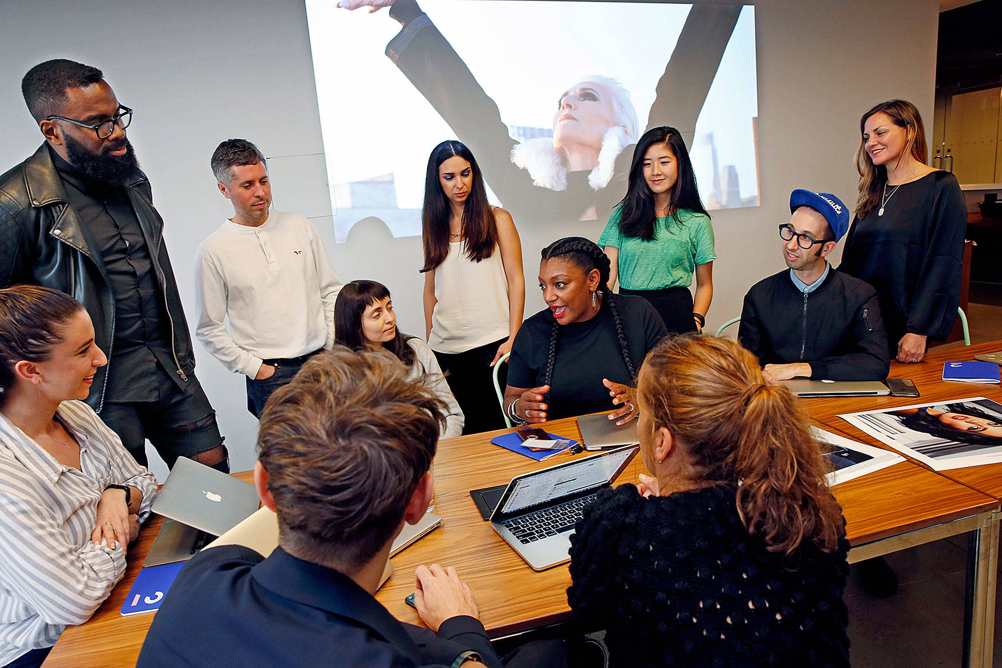 Members of the Droga5 team behind the recent CoverGirl campaign talk about that campaign during a meeting at the advertising agency’s headquarters in New York on Tuesday. (AP Photo/Kathy Willens)