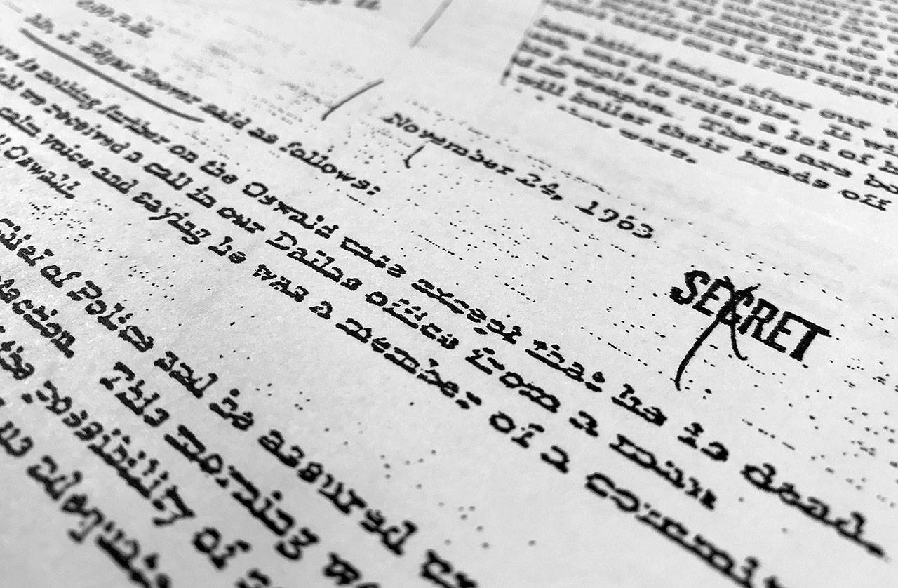 Part of a file, dated Nov. 24, 1963, quoting FBI director J. Edgar Hoover as he talks about the death of Lee Harvey Oswald, released for the first time on Thursday in Washington. (AP Photo/Jon Elswick)