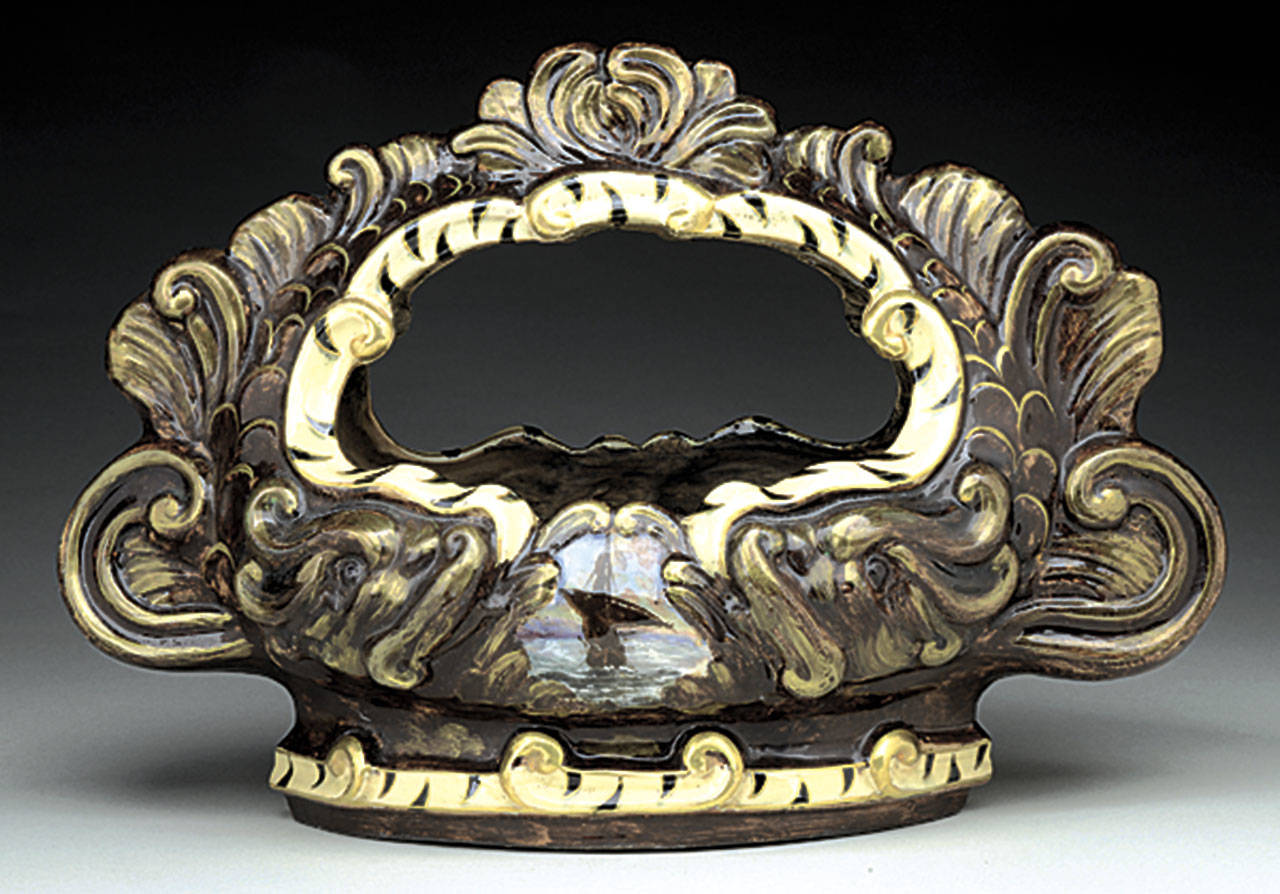 This 14-inch-wide faience bowl made by the Emile Galle factory sold for $968. The artist’s cameo glass brings much higher prices. (Cowles Syndicate Inc.)