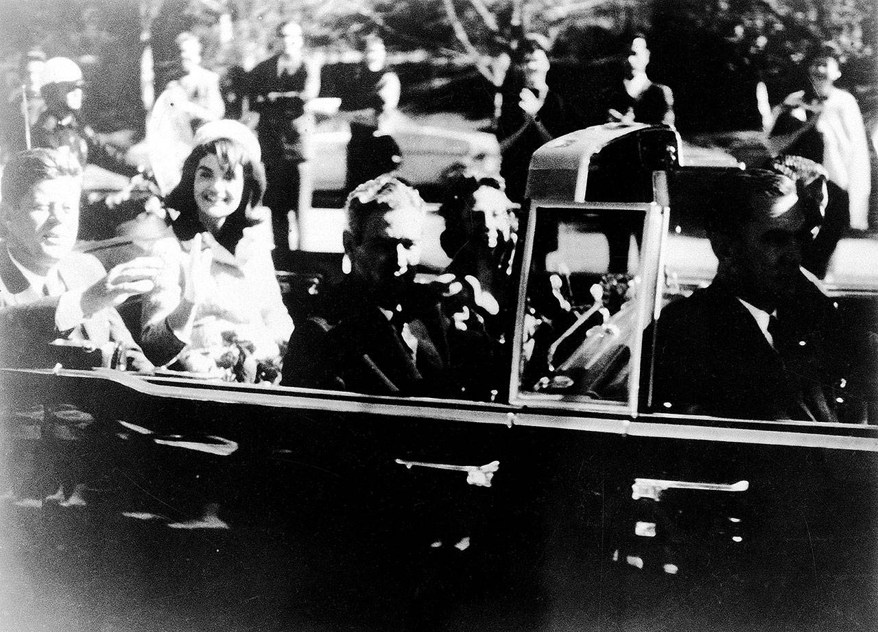 Warren Commission Exhibit No. 697 shows President John F. Kennedy on the rear seat of his limousine during the Dallas motorcade Nov. 22, 1963. His wife, Jacqueline, is beside him. Gov. John Connally of Texas and his wife were on jump seats in front of the president. (Warren Commission)