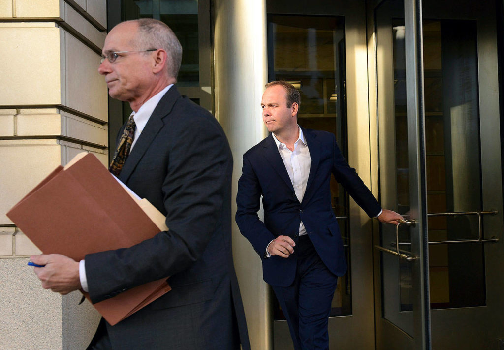 Rick Gates (right) leaves federal court in Washington on Monday. (AP Photo/Susan Walsh) 
