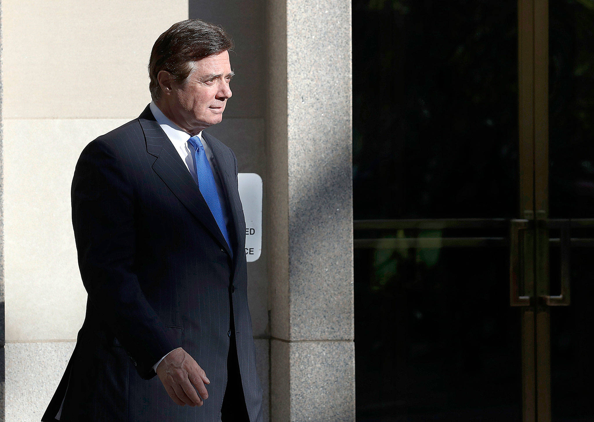 Paul Manafort walks from Federal District Court in Washington on Monday. (AP Photo/Alex Brandon)