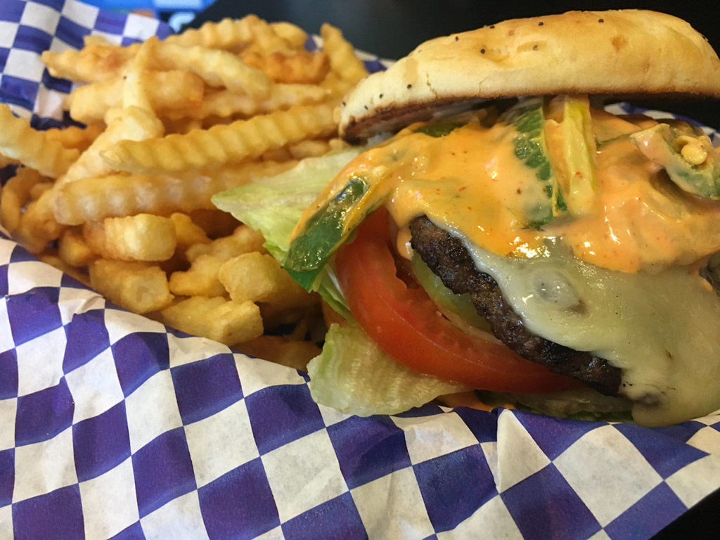 The Fire Alarm burger has all the trimmings plus jalapeno peppers, spicy sauce and pepperjack cheese. (Ben Watanabe / The Herald)

