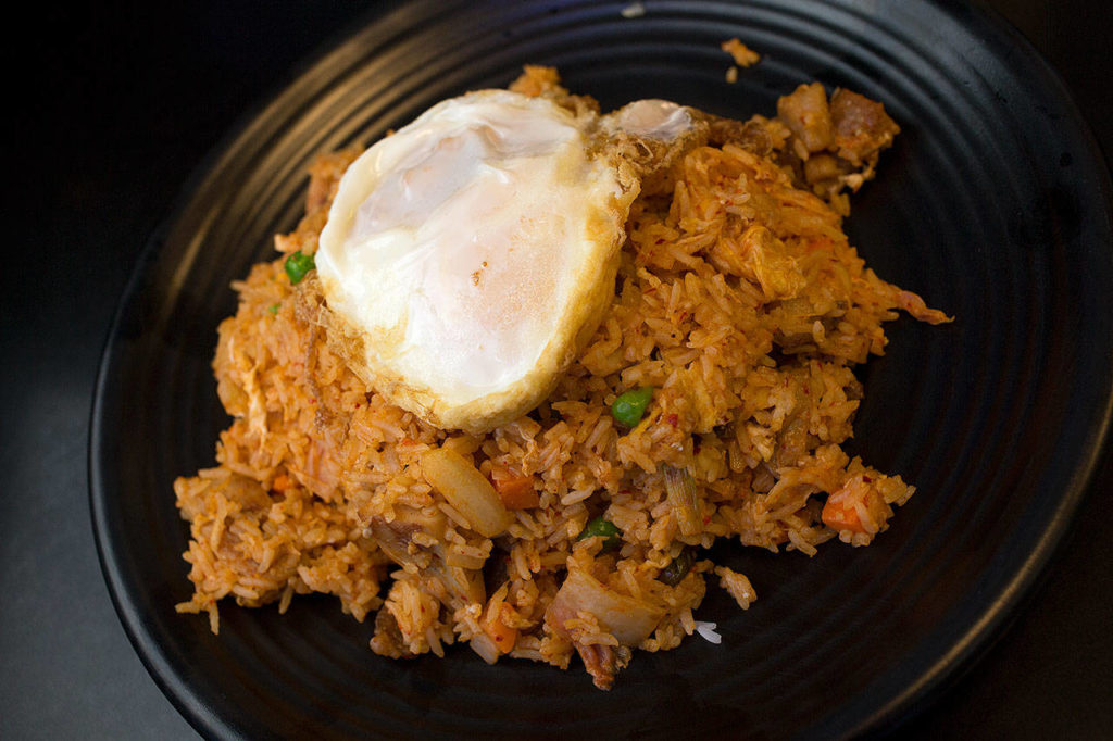 Korean fried rice topped with a fried egg. (Andrew Bronson / The Herald)
