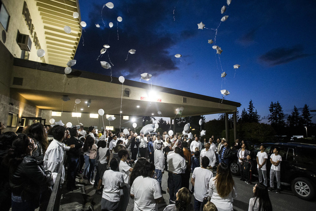 Family and friends of slain teenager David Sandoval release white balloons following a service at Bible Baptist Church on West Casino Road in Everett on Oct. 10 to honor his life. (Ian Terry / Herald file)
