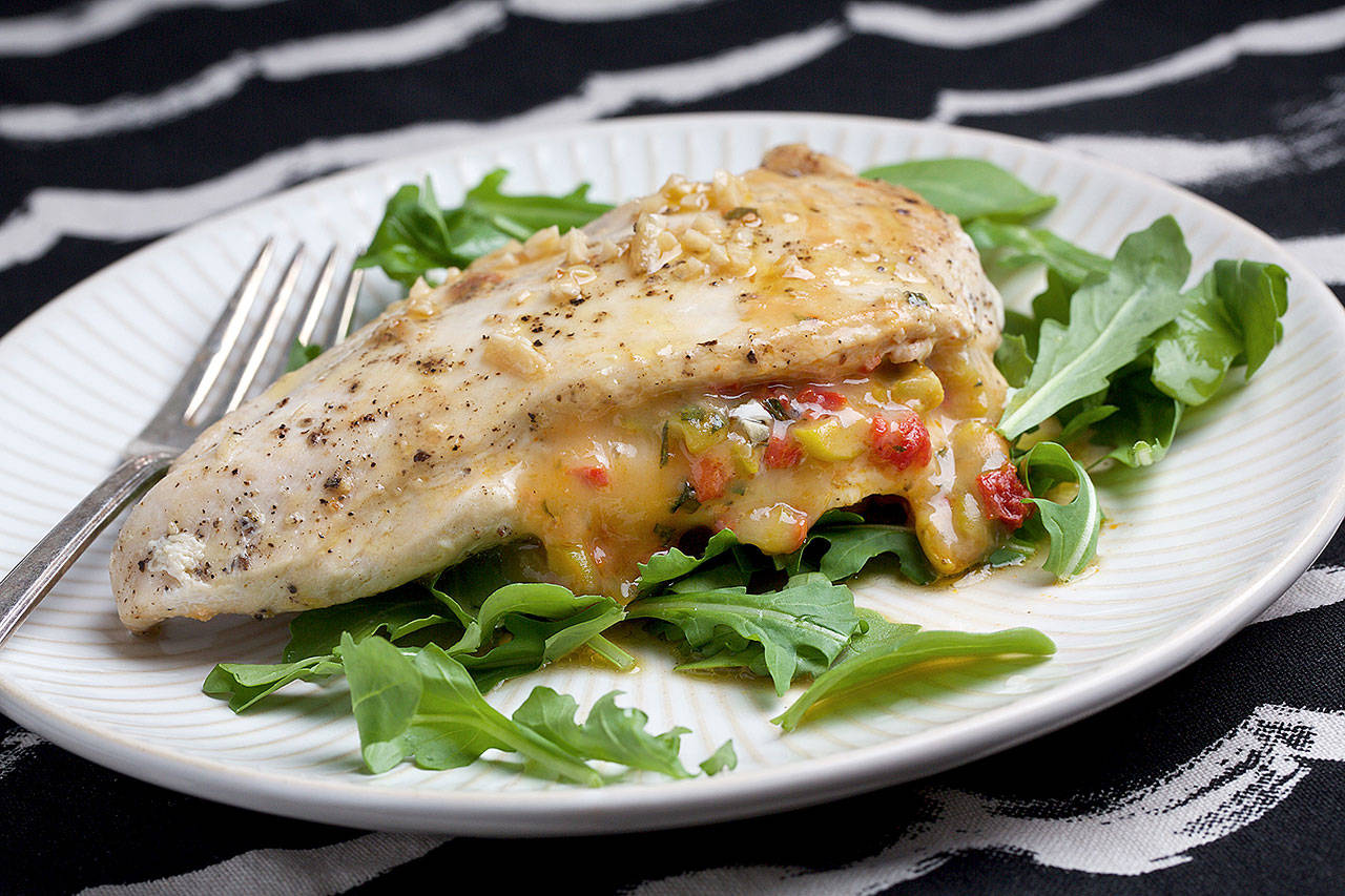 Roasted red pepper stuffed chicken breasts is a quick and easy dinner upgrade. (Photo by Deb Lindsey for The Washington Post)