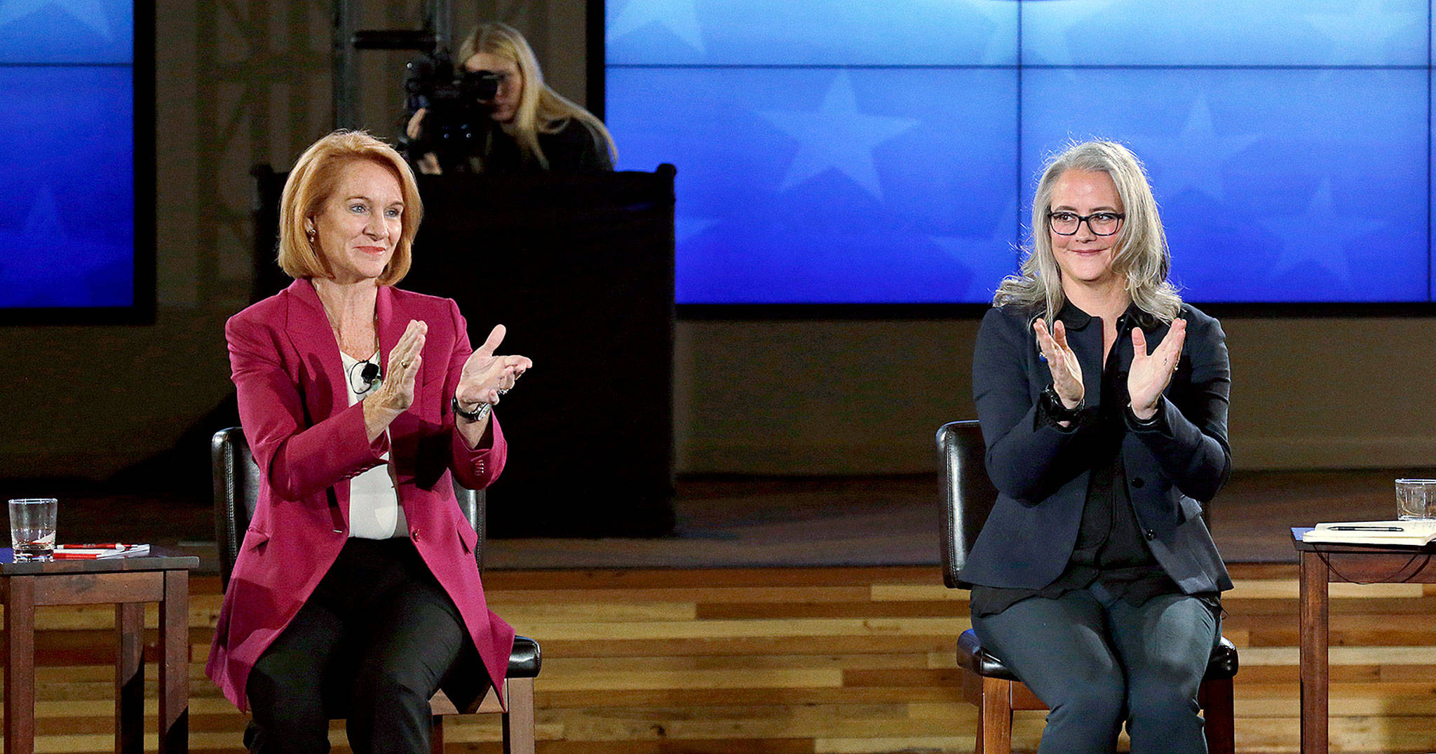 Seattle mayoral candidates Jenny Durkan (left) and Cary Moon at the end of a televised debate in Seattle. (AP Photo/Elaine Thompson)