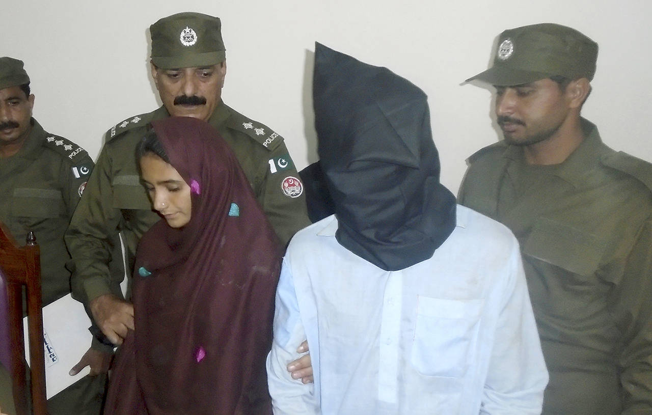 In this Oct. 30 photo, 21-year-old Aasia Bibi and her boyfriend, Shahid Lashari, are presented to journalists, at police station in Muzaffargarh in Pakistan. (AP Photo/Iram Asim)