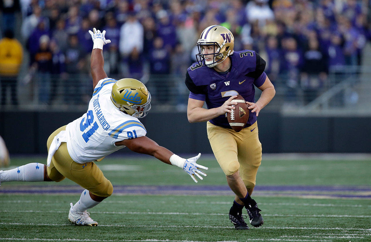Washington quarterback Jake Browning in action against UCLA in the first half of a game Oct. 28, 2017, in Seattle. (AP Photo/Elaine Thompson)