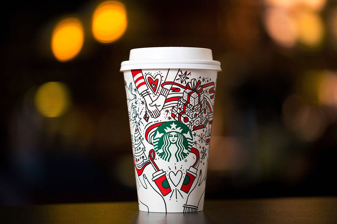 Starbucks’ latest holiday cup is mostly white, for customers to color in themselves. (Starbucks)