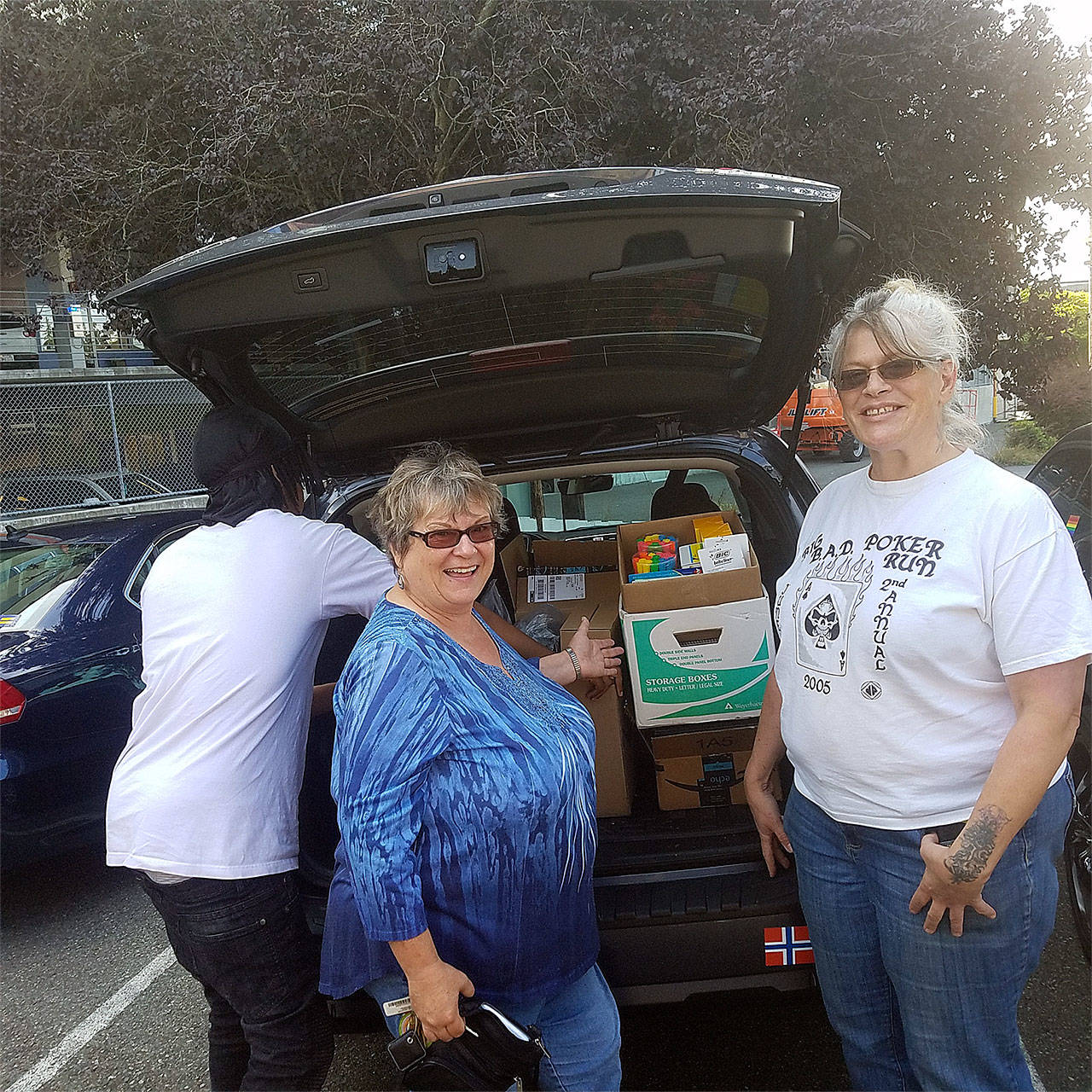 Elks grant coordinator Nancy Wolke and Cocoon House employee Billie Jean Crawford unload donated school supplies. (Contributed photo)