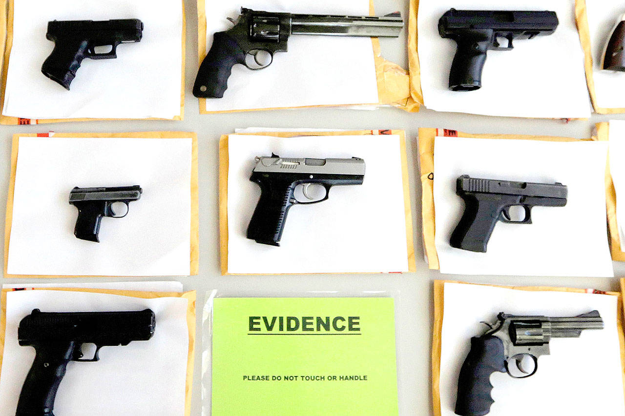 Some of the thousands of illegal firearms confiscated in Chicago in 2014. (AP Photo/M. Spencer Green, File)