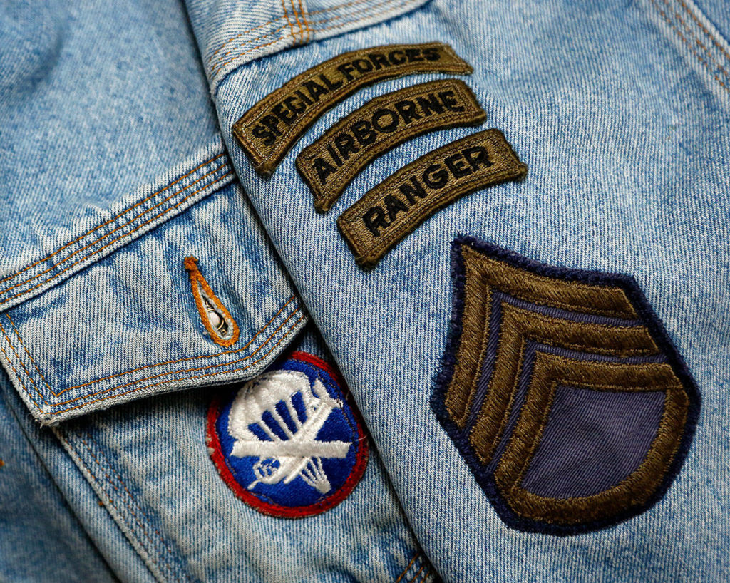 Fred Fillbrook, who served with the U.S. Army’s 82nd Airborne, helped establish Mill Creek’s Veterans Day parade several years ago. Fillbrook won’t be in the parade because he will be taking pictures of it. He’ll be wearing his highly recognizable denim jacket, though. (Dan Bates / The Herald)
