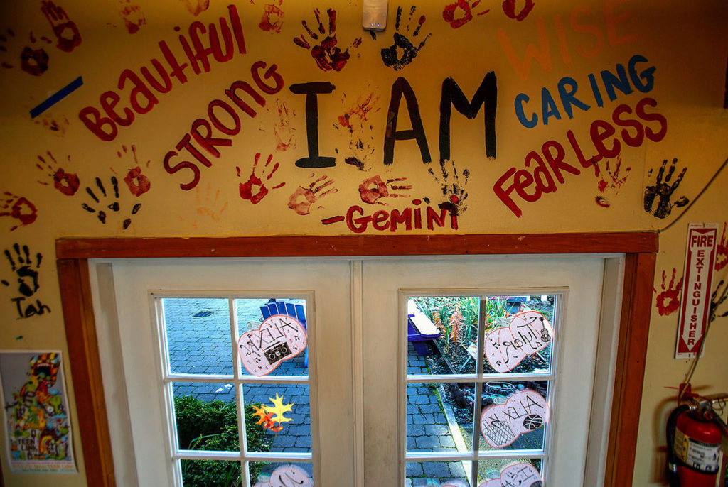 Just off the Cocoon House courtyard on Pine Street, teen residents find a cheery gathering place decorated with colorful hand-drawn artwork. (Dan Bates / The Herald)

