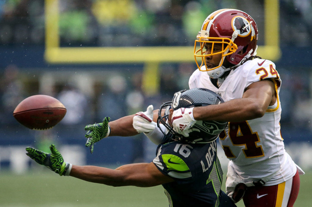 Redskins Josh Norman breaks up a pass intended for Seahawks wide receiver Tyler Lockett Sunday afternoon at CenturyLink Field in Seattle on November 5, 2017. Redskins won 17-14. (Kevin Clark / The Herald)
