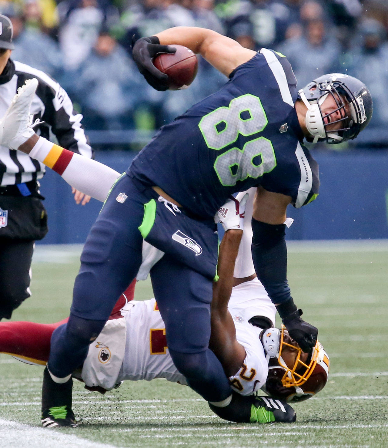 Seahawks tight end Jimmy Graham is tackled by Redskins Josh Norman Sunday afternoon at CenturyLink Field in Seattle on November 5, 2017. Redskins won 17-14. (Kevin Clark / The Herald)