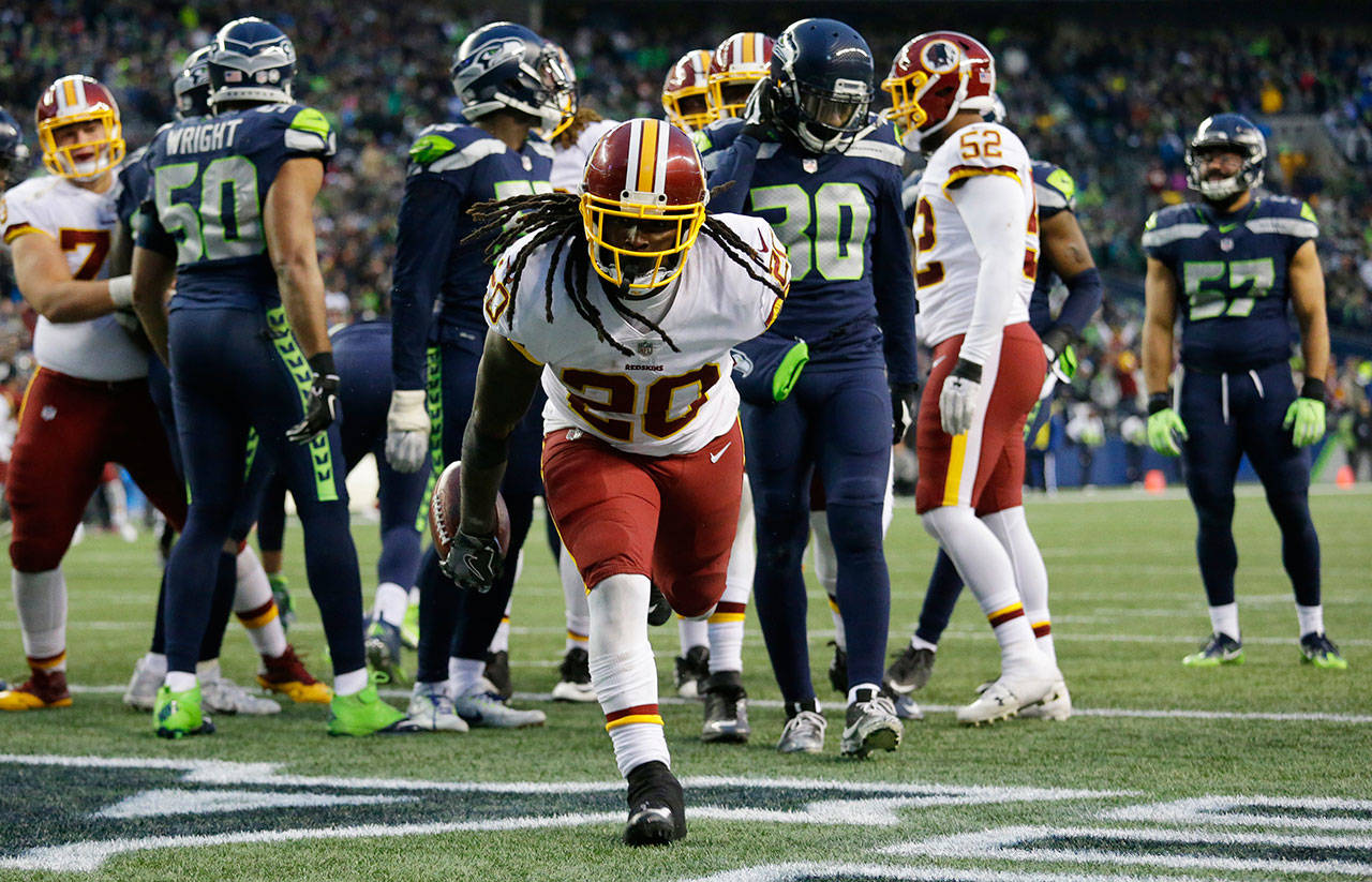 Washington Redskins running back Rob Kelley celebrates after scoring what proved to be the winning touchdown Sunday in a 17-14 victory over the Seattle Seahawks. (AP Photo/Elaine Thompson)