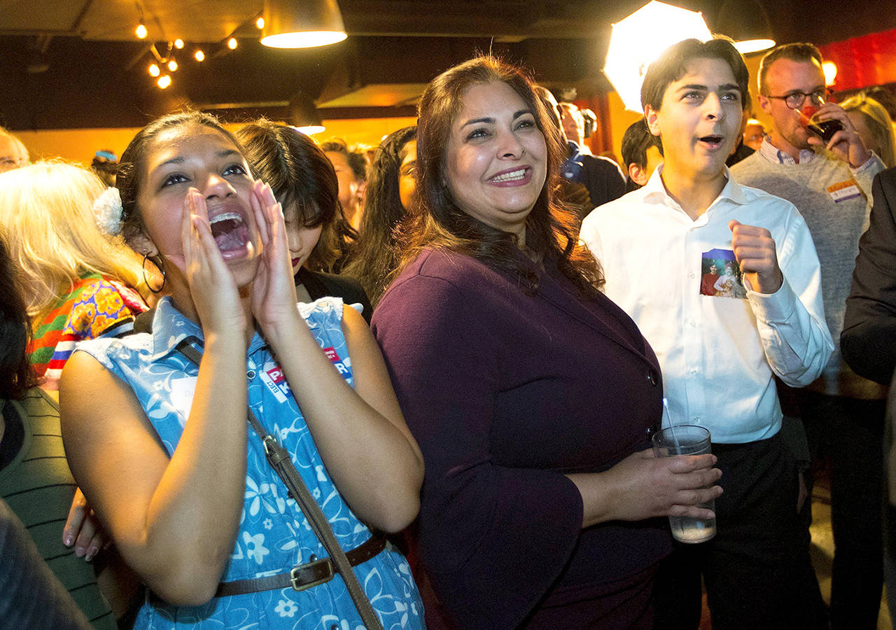 Democrat Manka Dhingra (center) running for State Senator for the 45th district, is congratulated by supporters after she takes the lead in early returns on election night in Woodinville. (Mike Siegel/The Seattle Times via AP)