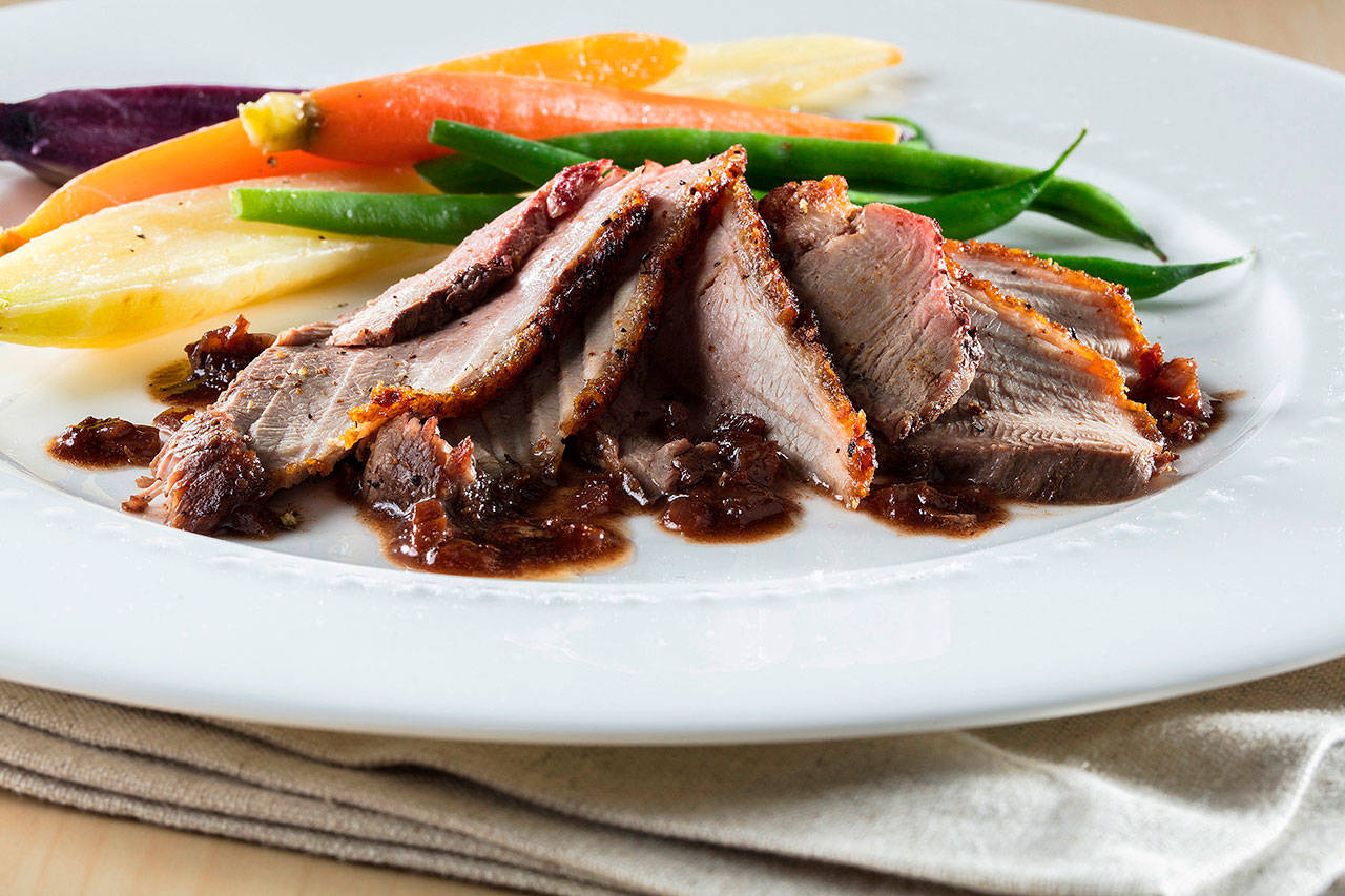 A sauce of sauteed shallots, butter and red wine dresses pan-fried duck breast. (Zbigniew Bzdak / Chicago Tribune)
