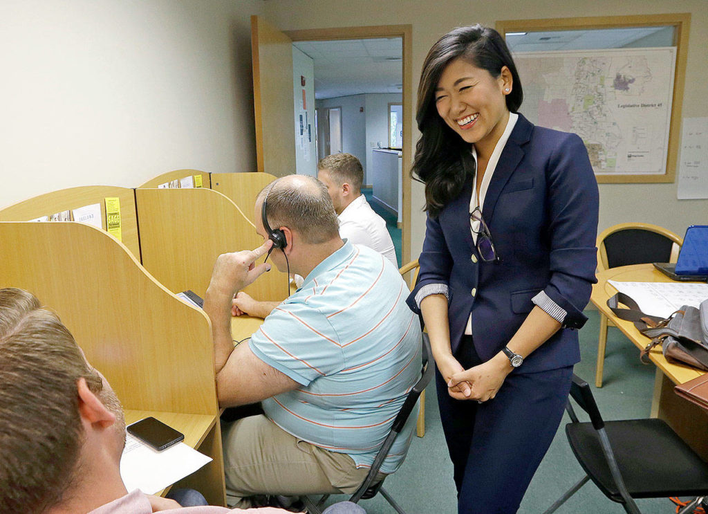 Jinyoung Lee Englund, candidate for the 45th District state Senate seat, talks with phone bank volunteers at her campaign headquarters in Woodinville. (AP Photo/Elaine Thompson, File) 
