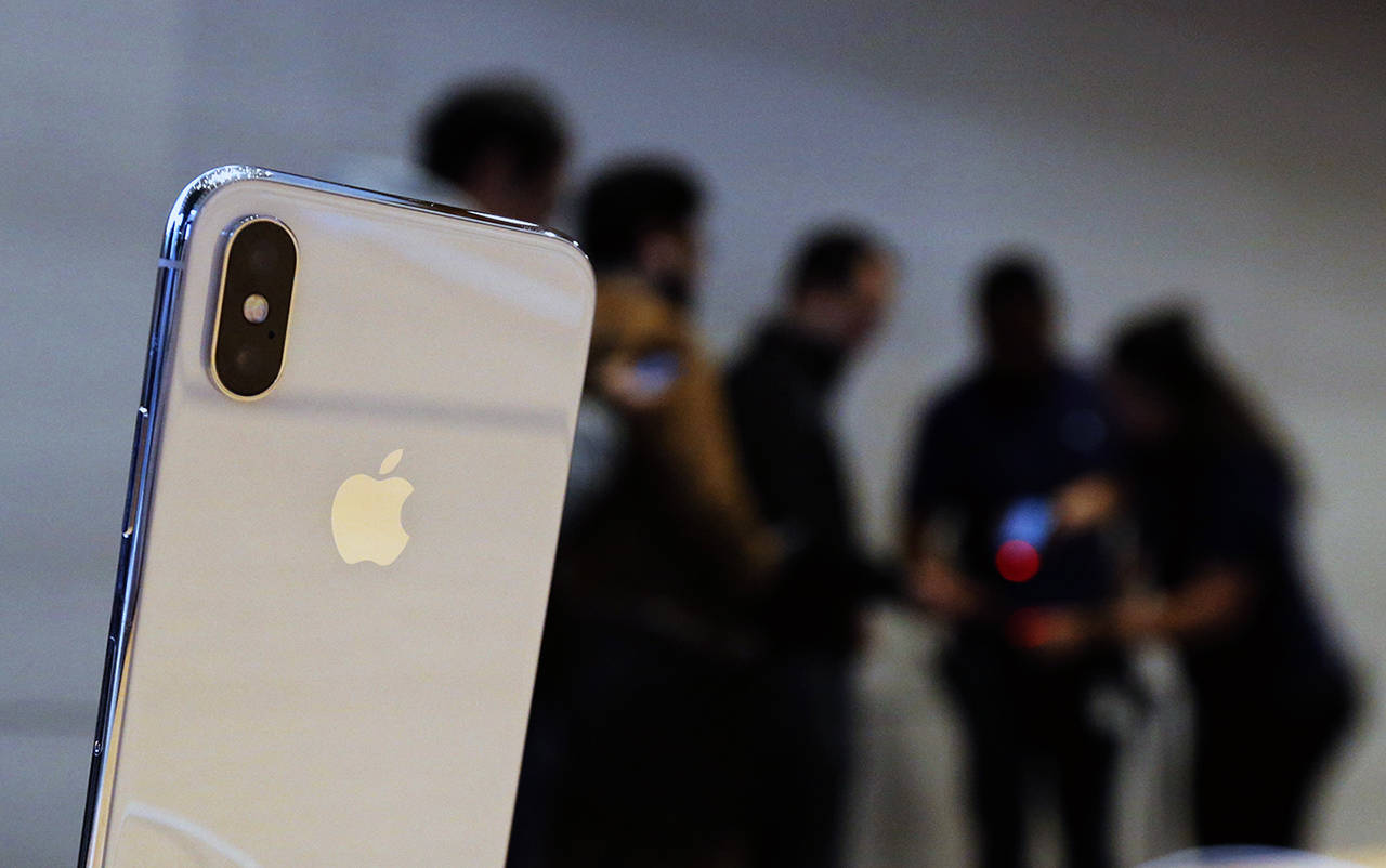 The new Apple iPhone X sits on display as consumers line up to buy it Nov. 3 in Chicago. (AP Photo/Charles Rex Arbogast)