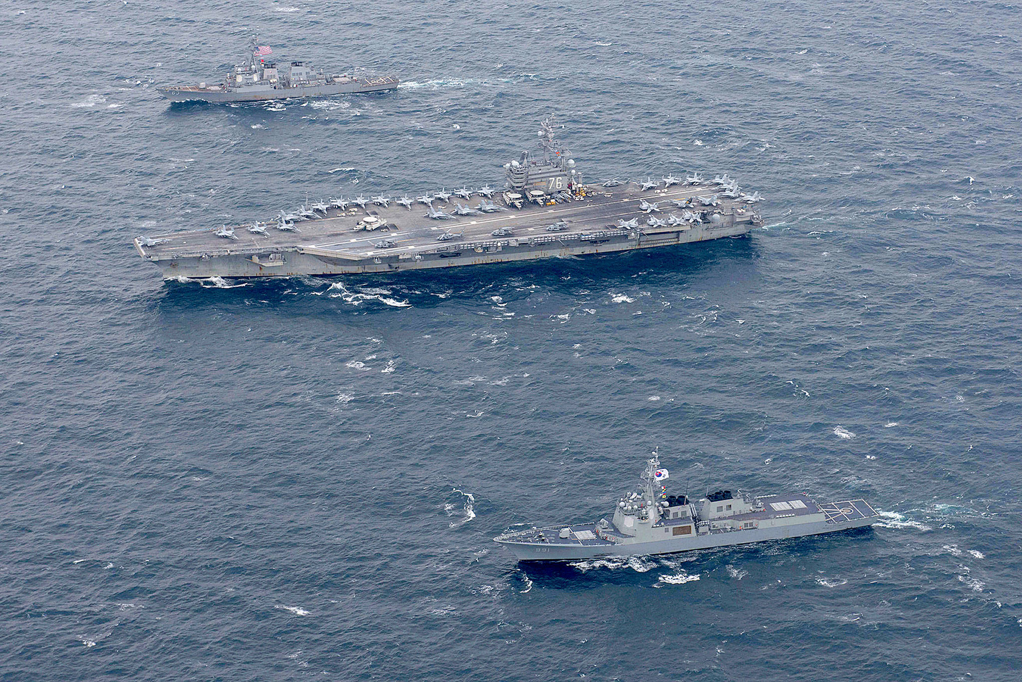 The USS Ronald Reagan (center), and the Arleigh Burke-class destroyer USS Stethem (left), steam alongside ships from the South Korean navy during joint drills Oct. 18 in waters east of the Korean Peninsula. (Mass Communication Specialist 2nd Class Kenneth Abbate/U.S. Navy)