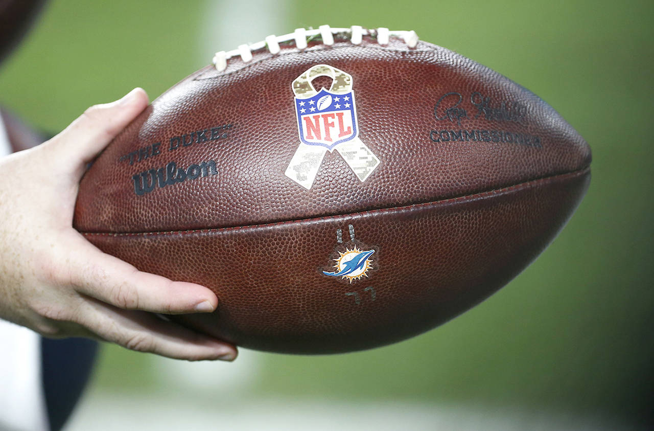 An NFL football with a Salute to Service logo, during the first half of an NFL football game between the Miami Dolphins and the Oakland Raiders on Nov. 5 in Miami Gardens, Florida. (AP Photo/Wilfredo Lee)