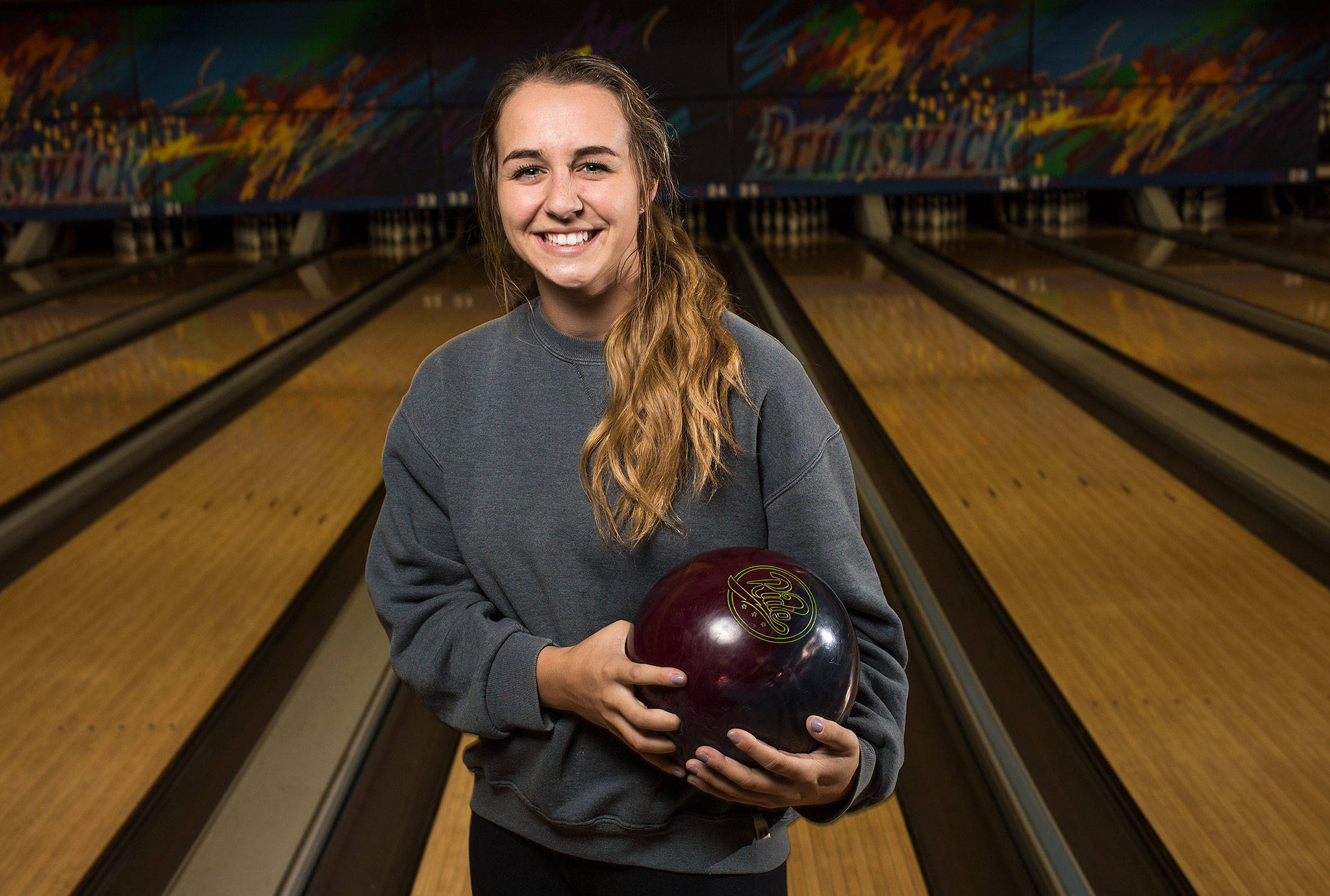 Jackson’s Sam Mutolo, shown here at Majestic Lanes in Lynnwood on Monday, has made herself into a state-caliber bowler despite being completely self-taught. Mutolo is also a standout softball player for the Timberwolves. (Andy Bronson / The Herald)