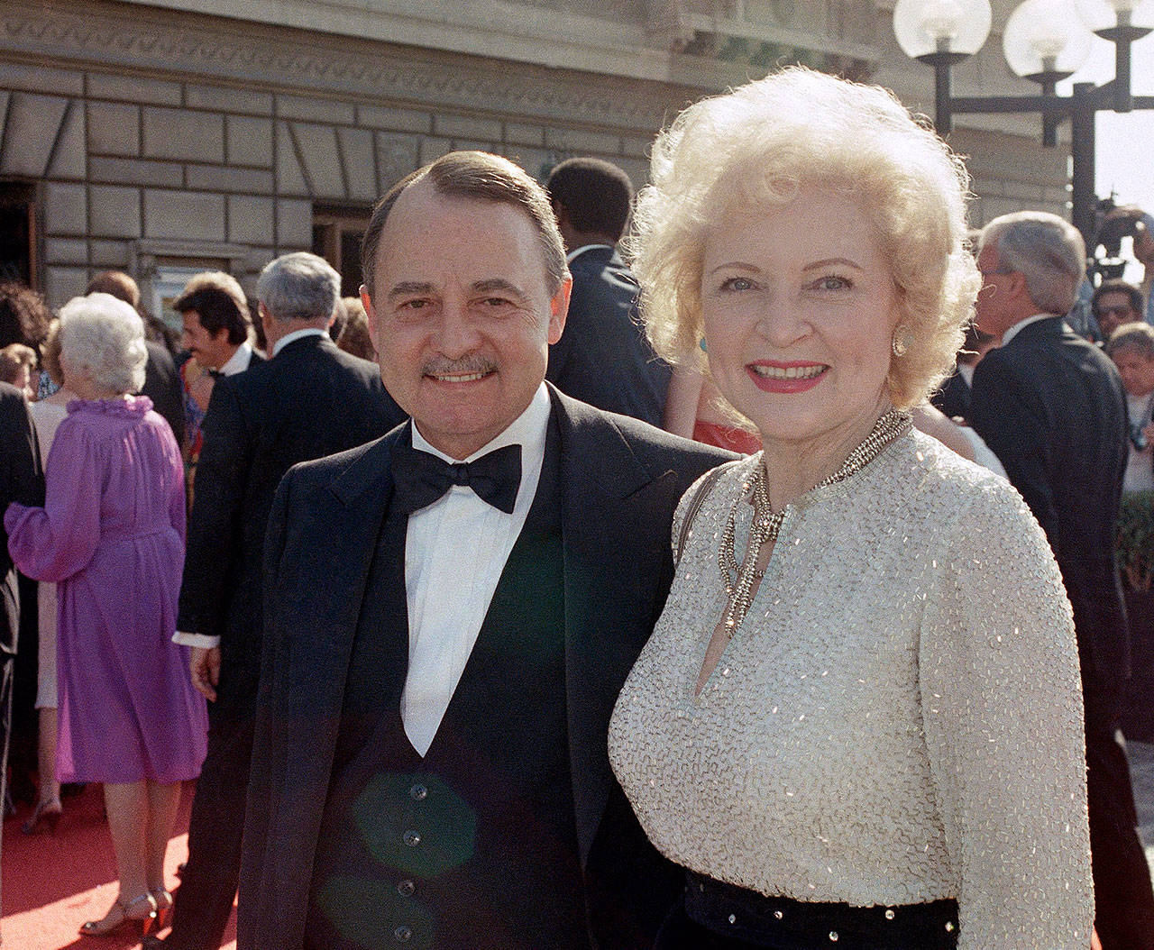 John Hillerman and Betty White arrive at the Emmy Awards in Pasadena, California, in 1985. (Associated Press file)