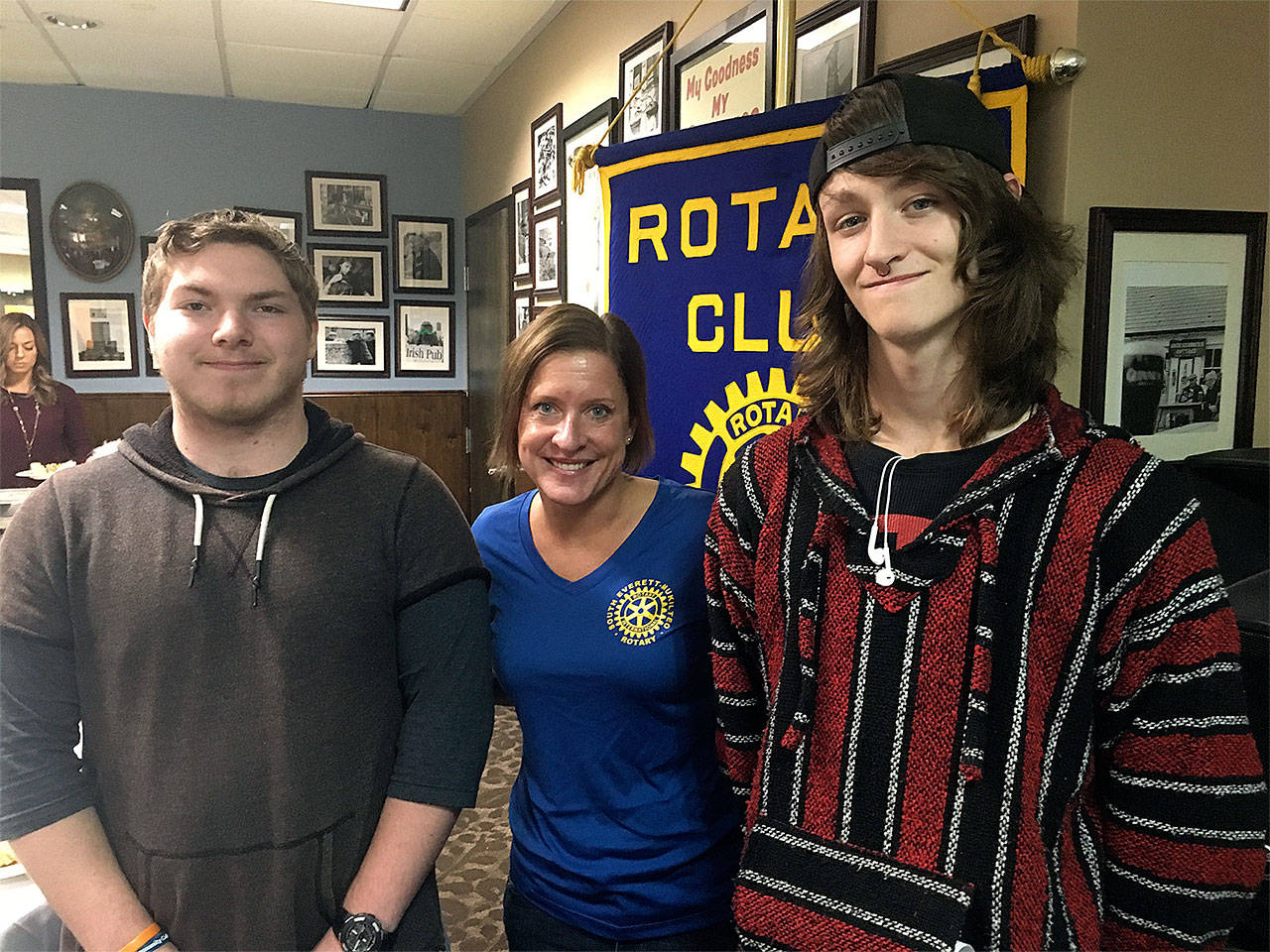 South Everett-Mukilteo Rotary Club president Julie Frauenholtz congratulates Students of the Month from ACES High School, Nik Hammond (left) and Jorden Johnson. (Contributed photo)