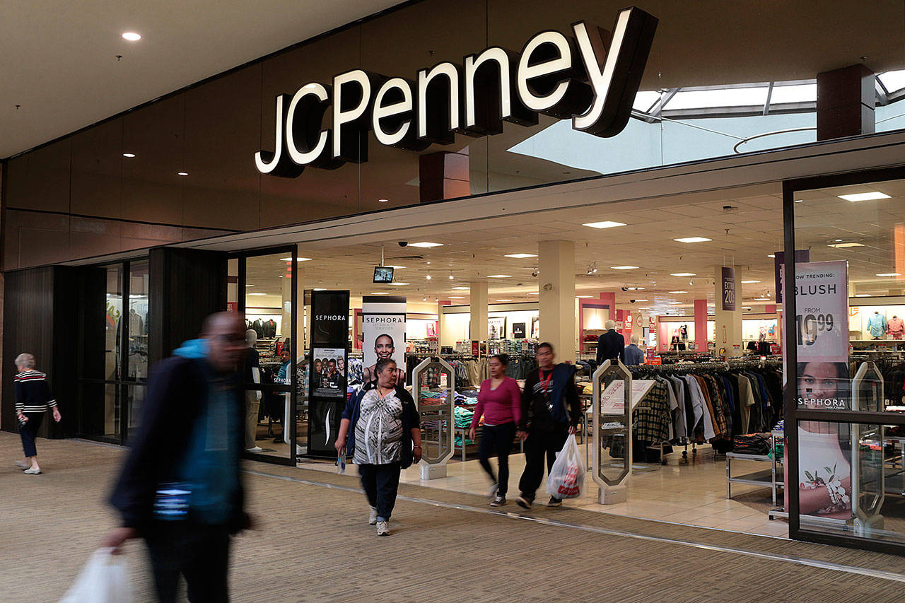 Shoppers leave a J.C. Penney store in the Georgia Square Mall in Athens, Georgia, in March. (John Roark/Athens Banner-Herald)