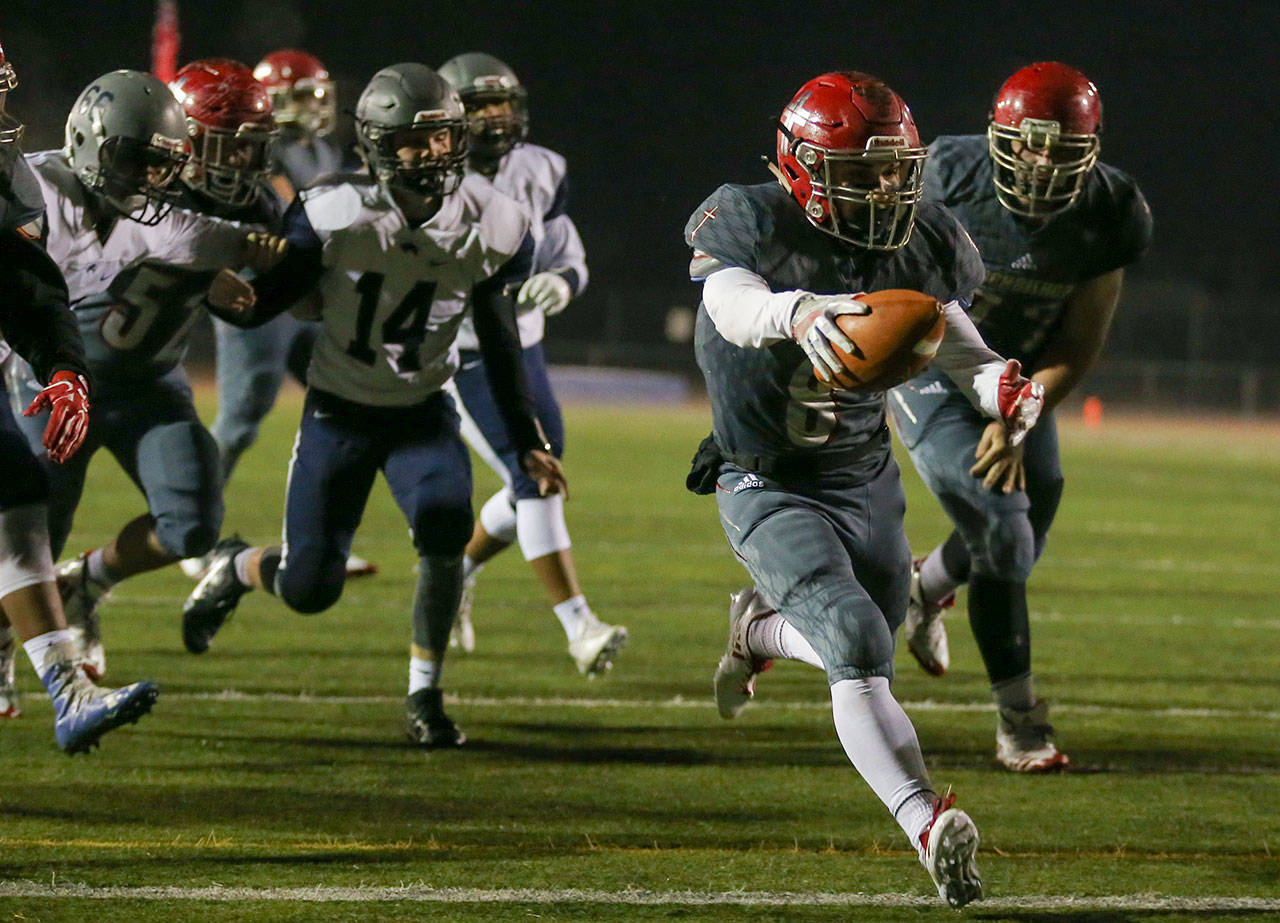 Archbishop Murphy’s Ray Pimentel stretches for the goal line and scores a touchdown against River Ridge in a 2A state playoff game Nov. 10, 2017, at Goddard Stadium in Everett. (Kevin Clark / The Herald)