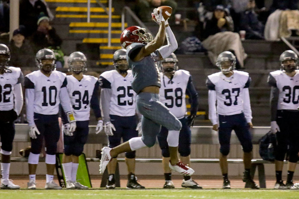 Archbishop Murphy’s Kyler Gordon makes a catch near the River Ridge sideline during a 2A state playoff game on Nov. 10, 2017, at Goddard Stadium in Everett. (Kevin Clark / The Herald)
