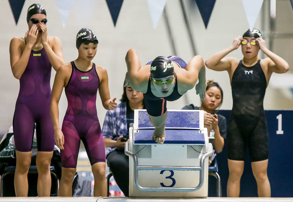 Jackson’s Chloe Limargo leads off in the 200-yard freestyle relay during the 4A state swim and dive championships on Nov. 11, 2017, at the King County Aquatic Center in Federal Way. Jackson finished third in the event. (Kevin Clark / The Herald)
