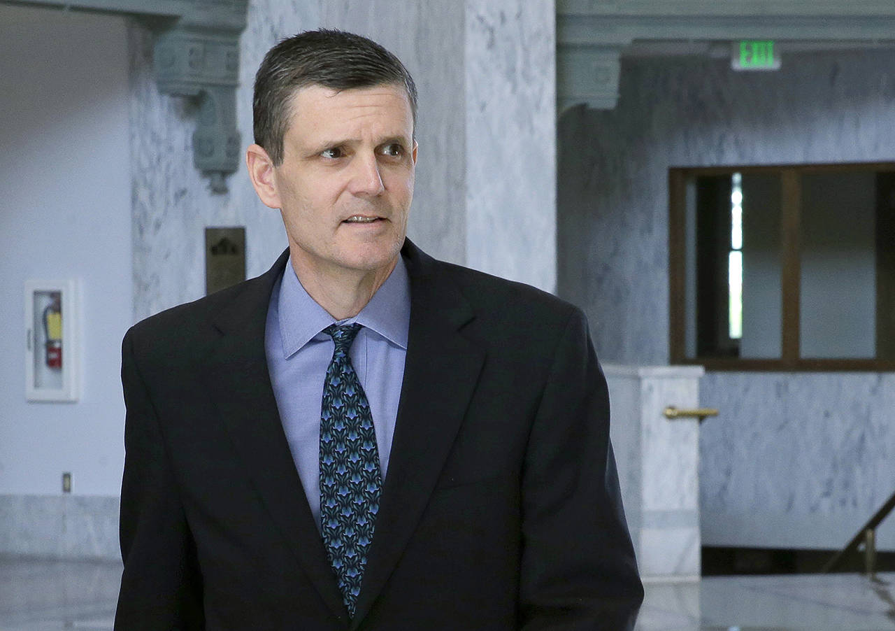In this 2016 photo, Washington State Auditor Troy Kelley leaves the federal courthouse in Tacoma. (AP Photo/Ted S. Warren, File)