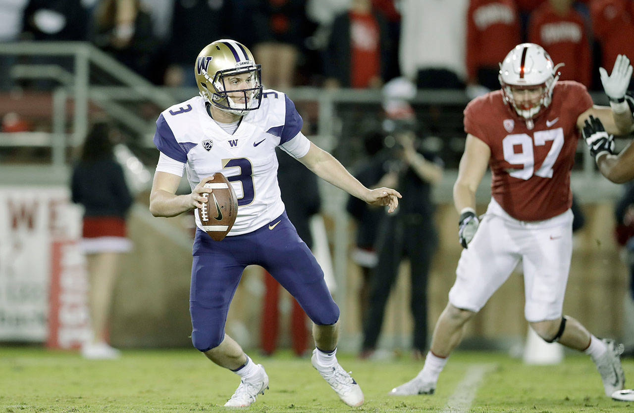 Washington’s Jake Browning moves in the pocket during the first half of the Huskies’ 30-22 loss at Stanford on Friday. Browning has not been as stellar in his junior season at UW as in his first two campaigns. (AP Photo/Marcio Jose Sanchez)