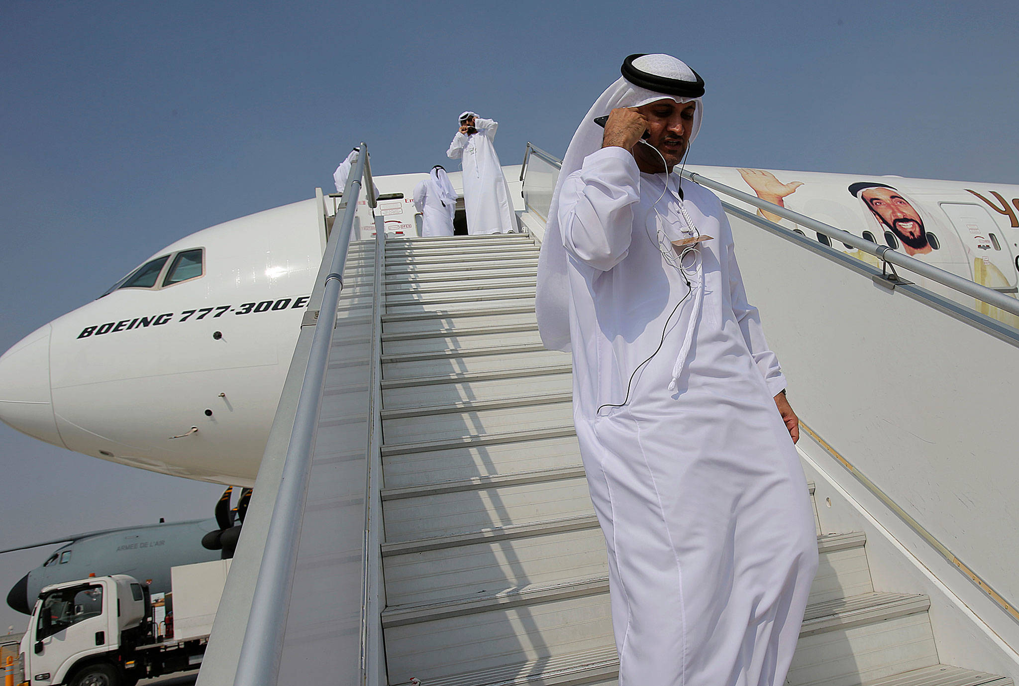 Emirati officials visit a Boeing 777 at the Dubai Air Show in the United Arab Emirates on Sunday. (AP Photo/Kamran Jebreili)