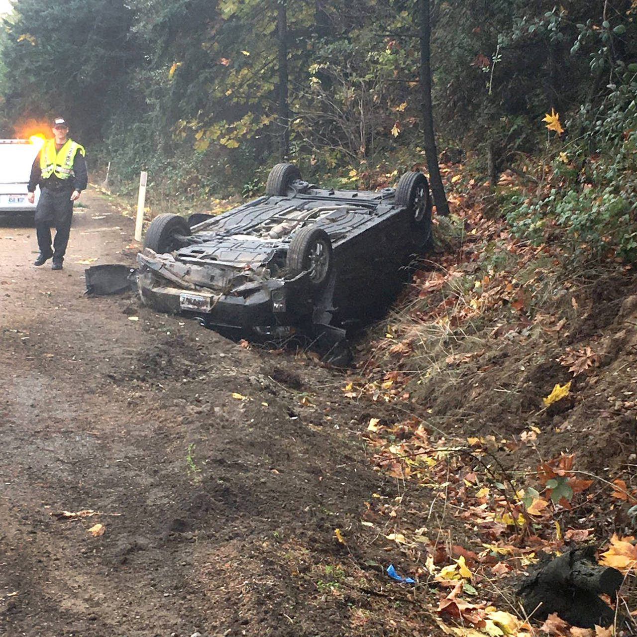 A car flipped into a ditch in a hit-and-run crash Tuesday morning on I-405 near Lynnwood, according to the Washington State Patrol. (Washington State Patrol)