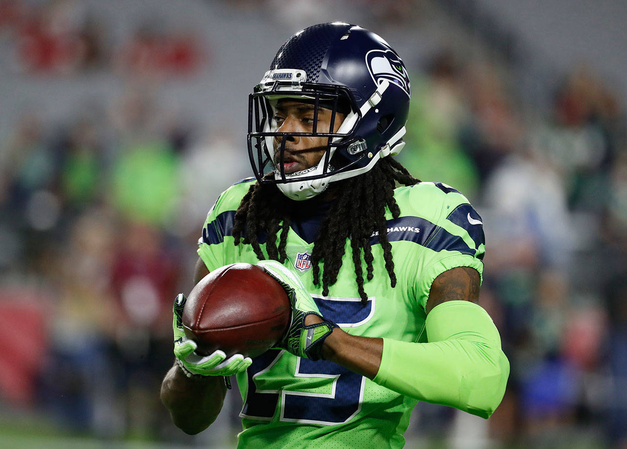 Seattle Seahawks cornerback Richard Sherman was placed on injured reserve Tuesday, ending his season. He ruptured his Achilles tendon during a Thursday Night Football game against the Arizona Cardinals, in Glendale, Ariz. (AP Photo/Rick Scuteri)