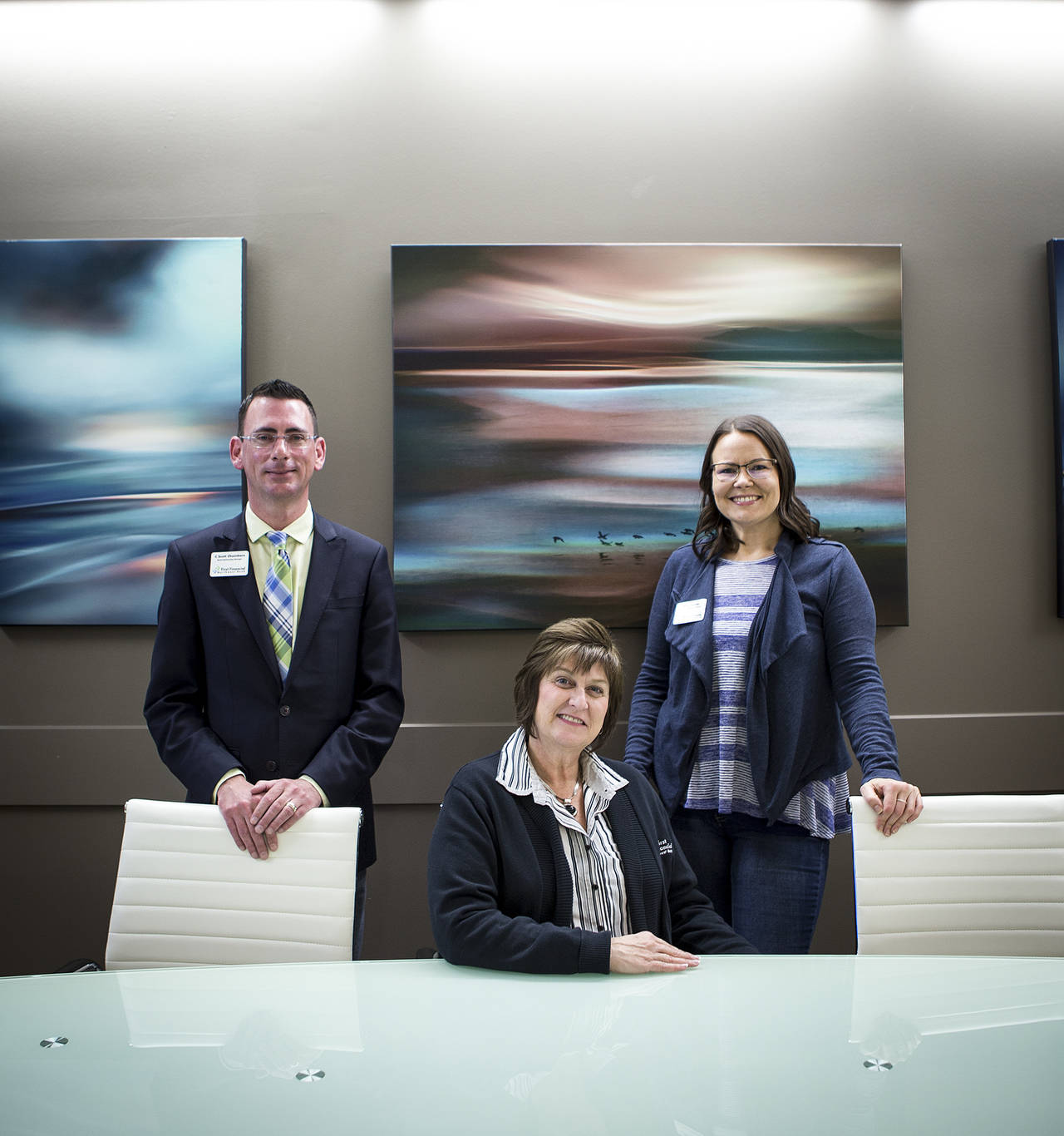 First Financial Northwest Bank’s Scott Chambers (left), Assistant Vice President, Dalen Harrison (center), Senior Vice President, and Elise Castle (right), Personal Banking Consultant (Ian Terry / The Herald)