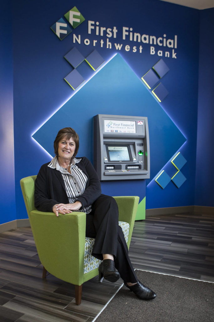 First Financial Northwest Bank’s Senior Vice President Dalen Harrison says that most accounts are opened in an “eye-to-eye” experience. That’s why her bank is adding branches at a time when many banks are shedding them. (Ian Terry / The Herald)
