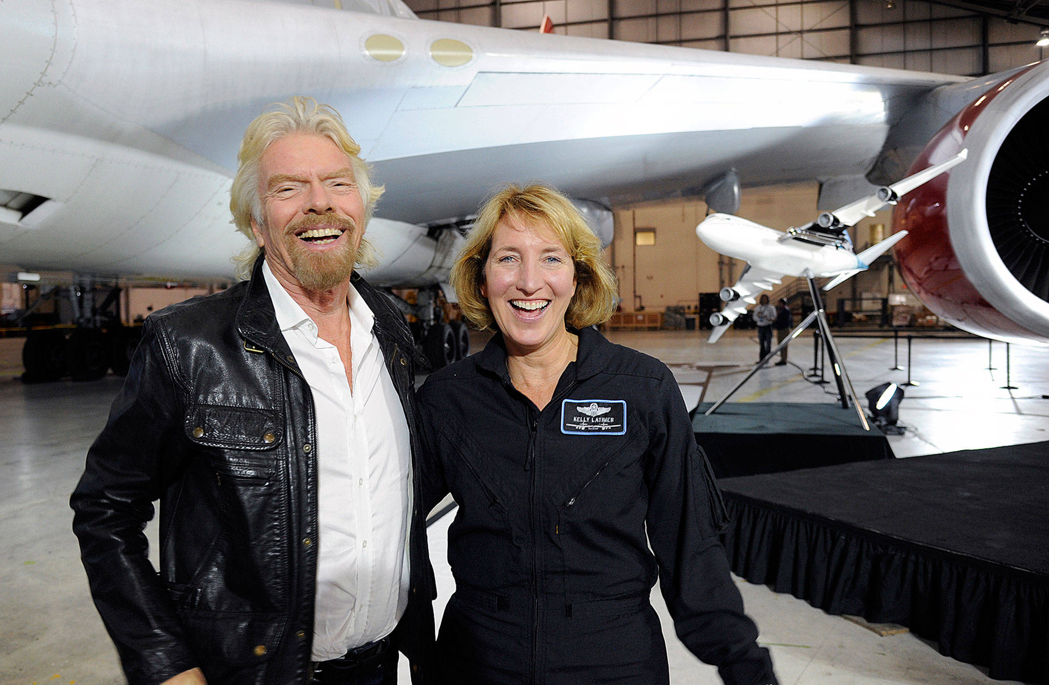 Virgin Galactic founder Richard Branson and pilot Kelly Latimer stand next to the 747-400 airplane that will be used to air launch the company’s rocket. (Virgin Galactic)