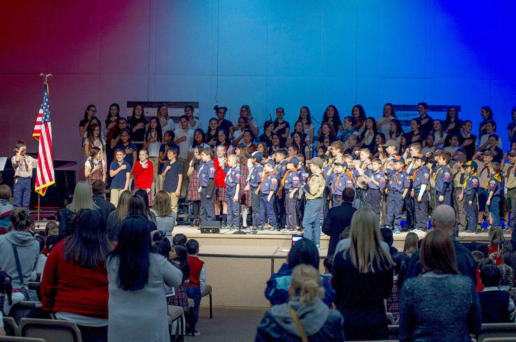 Cub Scout Pack 777 presents the flags at a Veterans Day assembly at Northshore Christian Academy in Everett. They also handed out thank-you cards to veterans in the crowd. (Contributed photo)
