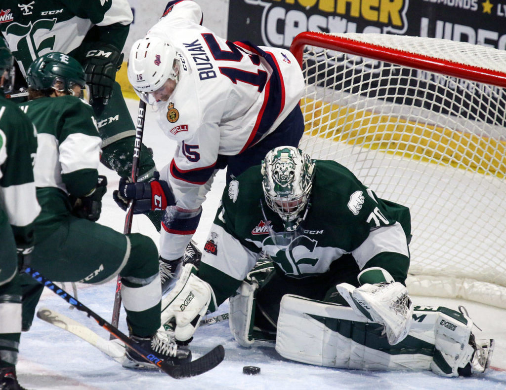 Everett’s Carter Hart defends the crease with Regina’s Braydon Buziak Sunday afternoon at Xfintiy Arena in Everett on November 19, 2017. Everett lost 2-1. (Kevin Clark / The Herald)
