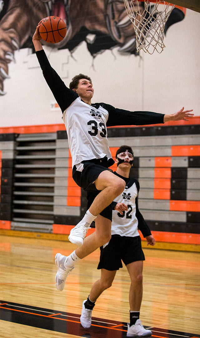 Monroe High’s Colby Kyle dunks the ball during practice on Monday, Nov. 20, 2017 in Monroe, Wa. (Andy Bronson / The Herald)